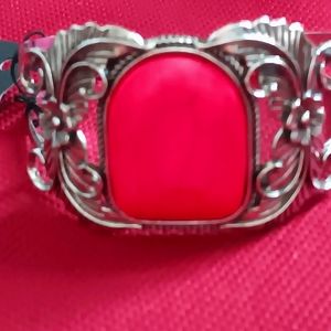 Cuff bracelet hot pink center with ornate flowers adorn each side. Paparazzi.